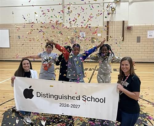 banner and students cheering