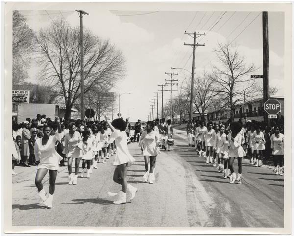 A drill team performs in a parade