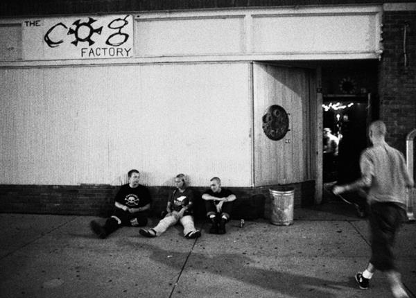 Patrons sit out front of the Cog Factory concert venue