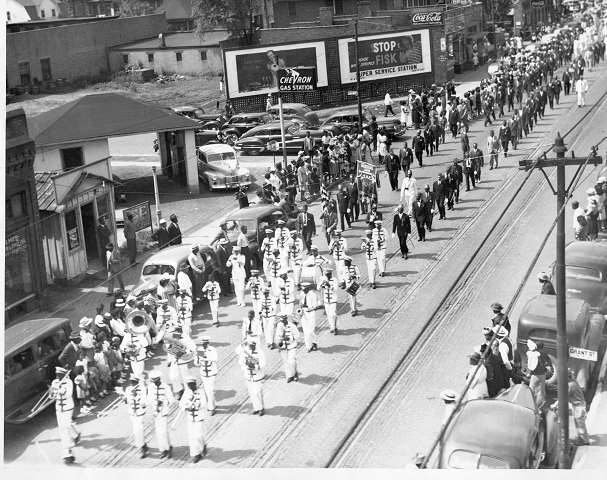 A marching band leads a parade
