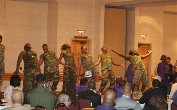Members of a Black Letter Organization perform for an audience