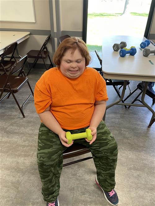 girl in chair with weight