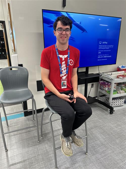 man in front of tv screen