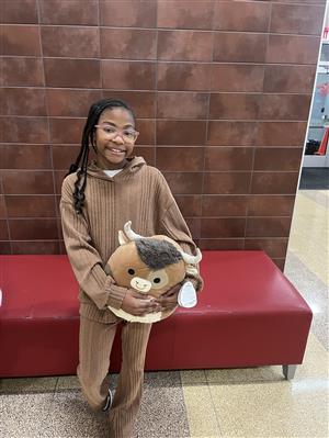  a student with a squishmallow